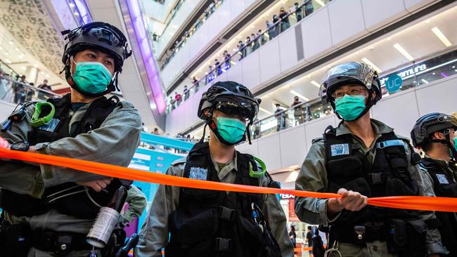 Riot police at a demonstration in a Hong Kong mall on July 6 after the new national security law made political views, slogans and signs advocating independence or liberation illegal. Picture: AFP