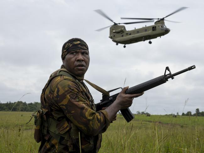 A Papua New Guinea Defence Force soldier from 2nd Royal Pacific Island Regiment waits for a CH-47 Chinook from 5th Aviation Regiment to land after a clearance of Sepik Plains, Wewak, Papua New Guinea as part of Exercise Wantok Warrior 24. PHOTO: CPL Brandon Grey