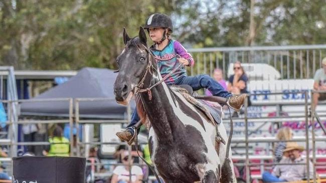 Cobie Holloway, 6, takes on the under 18s in barrel racing on her horse Rake. PHOTO: Supplied