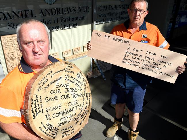 Brett Bould and Anthony Wilkes deliver some timber from the Heyfield Mill to Daniel Andrews’ electoral office in Noble Park. Picture: Nicole Garmston