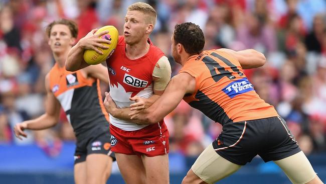 Daniel Hannebery tackled by Shane Mumford during their qualifying final last year.