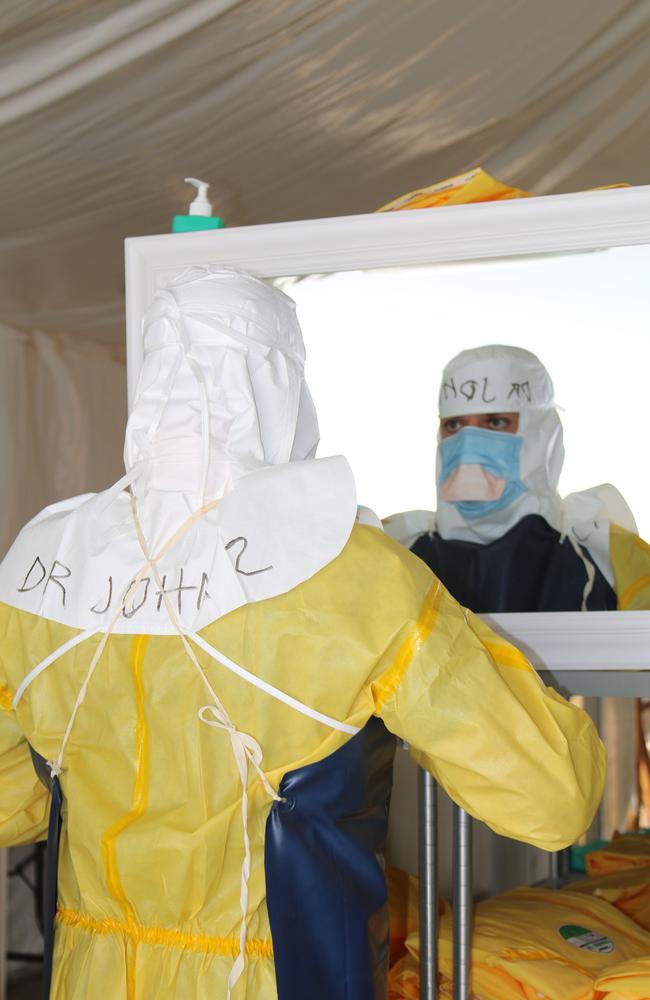 Dr John Gerrard suited up and ready to head into the red zone of the ebola treatment centre in Sierra Leone in 2014.