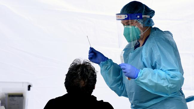 People are swabbed at a COVID-19 testing site at Rushcutters Bay in Sydney. The nearby the Cruising Yacht Club is closed after a member tested positive for COVID-19. Picture: NCA NewsWire/Joel Carrett