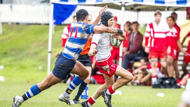 Kyle Colburn is tackled by Sione Tapuosi in the GPS First XV rugby match – Picture: Richard Walker