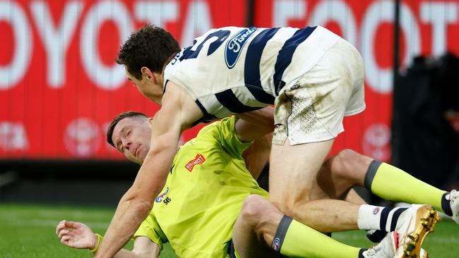 Jeremy Cameron collides with the boundary umpire. Picture: Michael Willson