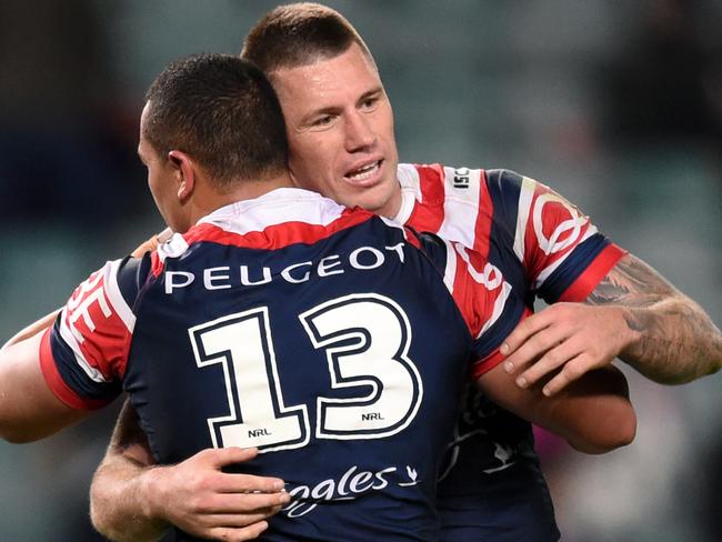 Shaun Kenny-Dowall and Sio Siua Taukeiaho celebrate beating the Cowboys.