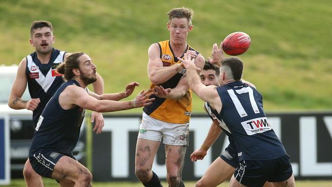 Strathmore star Luke Jarrad fires off a handball on Saturday. Picture: Hamish Blair