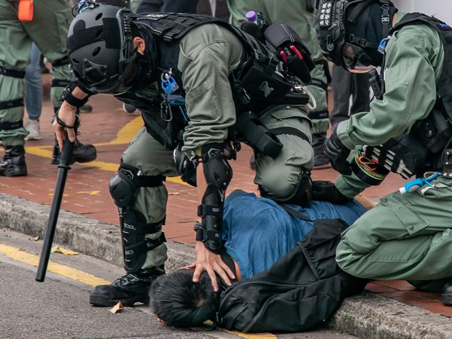 A pro-democracy supporter is detained by riot police during an anti-government rally in Hong Kong, China. Picture: Getty Images