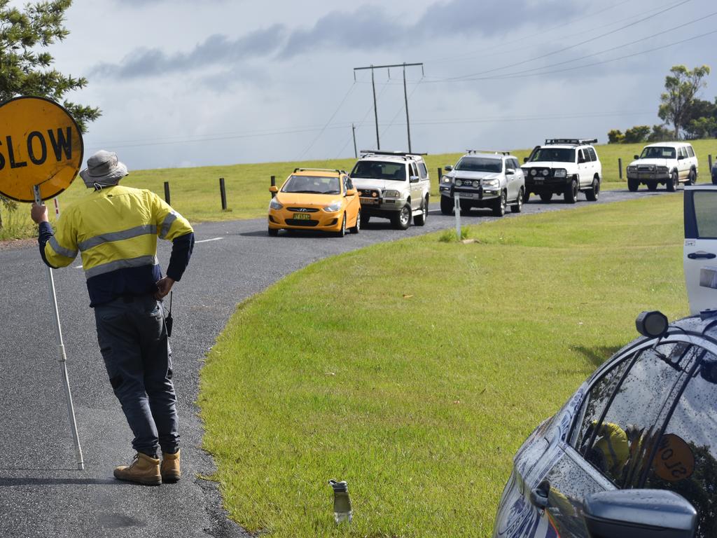 Traffic was blocked in both directions after a red sedan Mitsubishi Lancer sedan crashed into a power pole on Rogans Bridge Rd north of Waterview Heights on Thursday, 18th February, 2021. Photo Bill North / The Daily Examiner