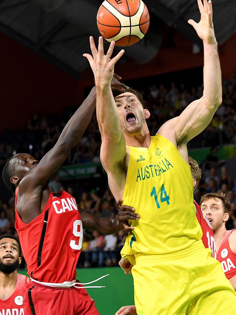 Angus Brandt of Australia drives to the basket