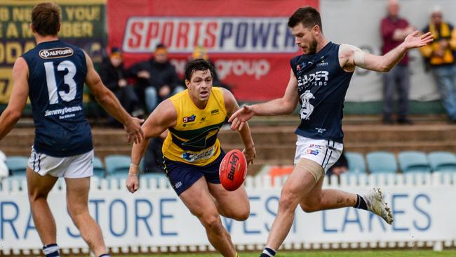 SouthÃs Bryce Gibbs kicks away from EagleÃs Jesse Lonergan during SANFL football between the Eagles and South Adelaide at Woodville Oval., Saturday May 08, 2021. Picture: Brenton Edwards