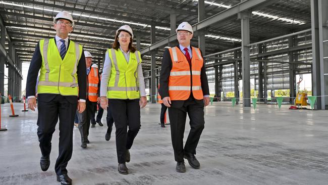 Queensland Minister for State Development Cameron Dick and Premier Annastacia Palaszczuk with Rheinmetall Managing Director Gary Stewart at their Redbank facility.