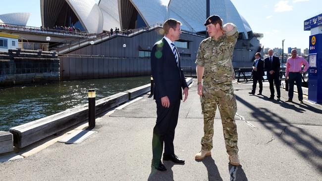 A quieter moment as Prince Harry speaks with Premier Mike Baird upon arrival at the Opera House. Picture: Getty