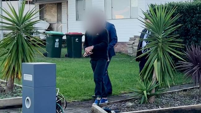 Stephen Staff being arrested at his residence in Lake Illawarra on Wednesday. Picture: NSW Police