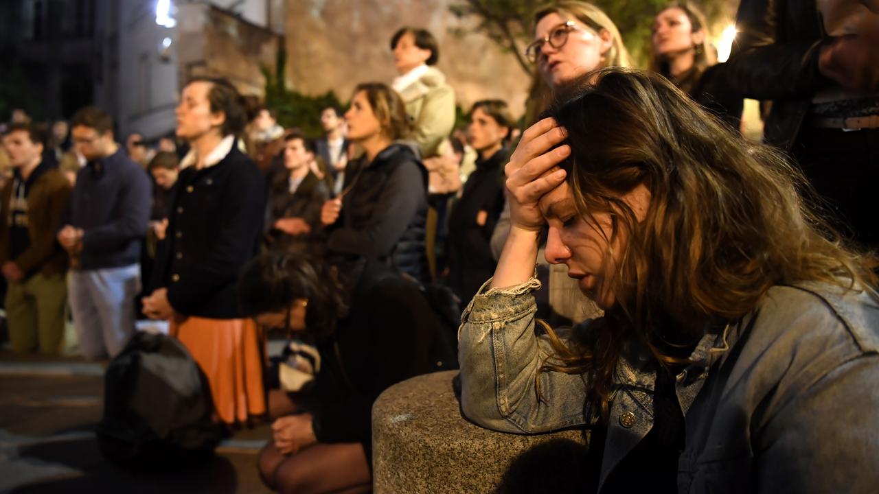 Emotional crowds stood together in disbelief and anguish. Picture: Eric Feferberg