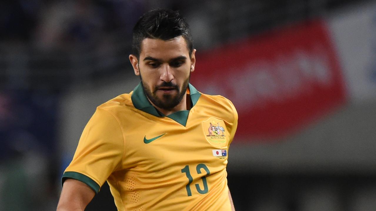 OSAKA, JAPAN - NOVEMBER 18:Aziz Behich of Australia keeps the ball during the international friendly match between Japan and Australia at Nagai Stadium on November 18, 2014 in Osaka, Japan. (Photo by Kaz Photography/Getty Images)