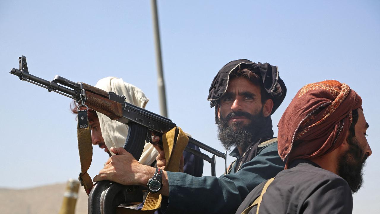 Taliban fighters stand guard in a vehicle along the roadside in Kabul. Picture: AFP