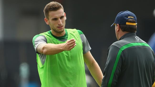 MELBOURNE, AUSTRALIA - JANUARY 04: Matthew Spiranovic of Australia speaks with coach Ange Postecoglou during an Australian Socceroos training session at Collingwood training Ground on January 4, 2015 in Melbourne, Australia. (Photo by Robert Cianflone/Getty Images)