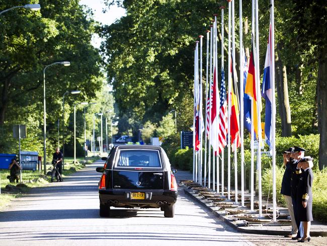 A convoy carrying the bodies of the flight MH17 victims arrives at Korporaal van Oudheusdenkazerne, a military establishment where the bodies will be examined and identified.