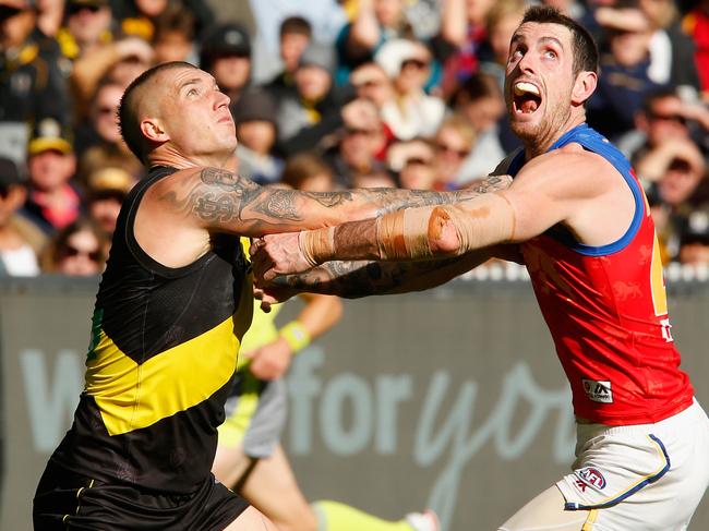 MELBOURNE, AUSTRALIA - APRIL 14:  Dustin Martin of the Tigers and Darcy Gardiner of the Lions compete during the round four AFL match between the Richmond Tigers and the Brisbane Lions at Melbourne Cricket Ground on April 14, 2018 in Melbourne, Australia.  (Photo by Darrian Traynor/Getty Images)