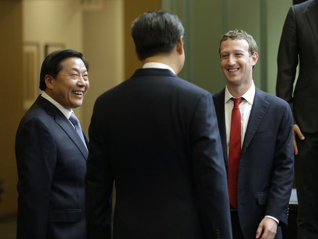 Chinese President Xi Jinping, centre, talks with Facebook Chief Executive Mark Zuckerberg, right, as Lu Wei, left, China's internet tsar, looks on. Picture: AP