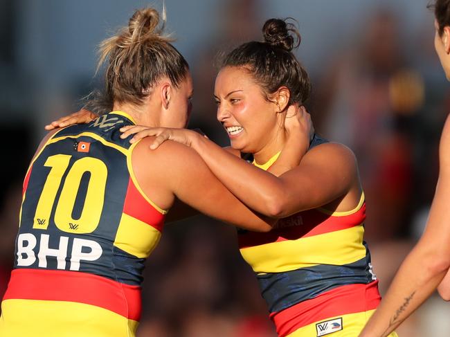 ADELAIDE, AUSTRALIA - FEBRUARY 3: Ruth Wallace of the Crows celebrates a goal with team mate Ebony Marinoff during the 2018 AFLW Round 01 match between the Adelaide Crows and the Brisbane Lions at Norwood Oval on February 3, 2018 in Adelaide, Australia. (Photo by AFL Media/Getty Images)