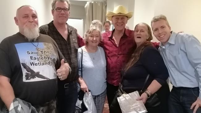 Aussie rock legend Russell Morris meets members of the Eagleby Wetlands Conservation Group who are fighting the state government to stop a six-lane highway ploughing through their community. PHOTO: Eagleby Community and Wetlands Group.