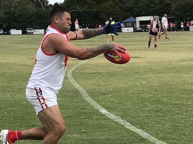 Marc Holt kicks his first goal for Karingal against Devon Meadows on Sunday.