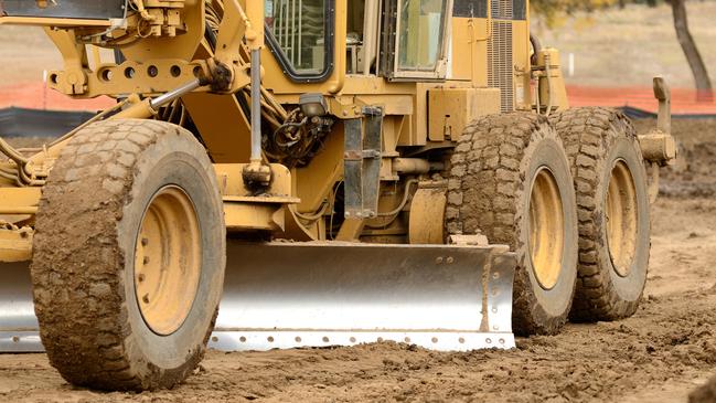 WorkSafe is investigating after a man was run over by a grader at a Melton worksite.