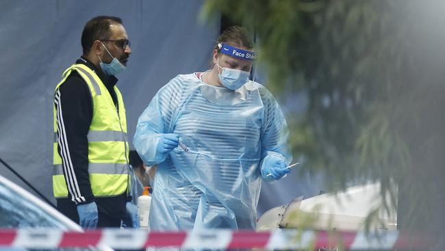 COVID-19 testing staff attend a pop-up site at Keilor community hub in Melbourne. Picture: Getty Images