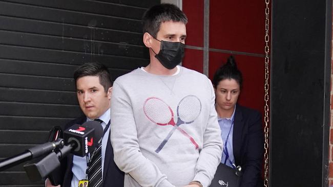 Richard Pusey is arrested at his Fitzroy home. Picture. AAP