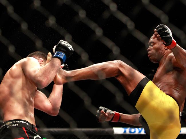 Anderson Silva (R) kicks Nick Diaz in their middleweight bout during UFC 183 at the MGM Grand Garden Arena.