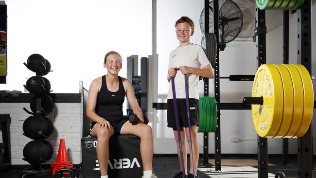 Workout buddies Daisy White and Tyler Smith, both 13, after a workout at their gym in Gymea. Picture: Jonathan Ng