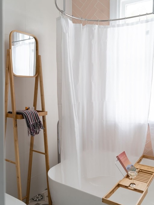 The bath offers a moment of quiet and a place to prop up your book.