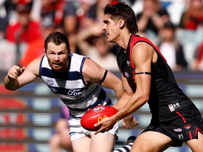 MELBOURNE, AUSTRALIA - APRIL 30: Brandon Zerk-Thatcher of the Bombers is chased by Patrick Dangerfield of the Cats during the 2023 AFL Round 07 match between the Essendon Bombers and the Geelong Cats at the Melbourne Cricket Ground on April 30, 2023 in Melbourne, Australia. (Photo by Michael Willson/AFL Photos via Getty Images)