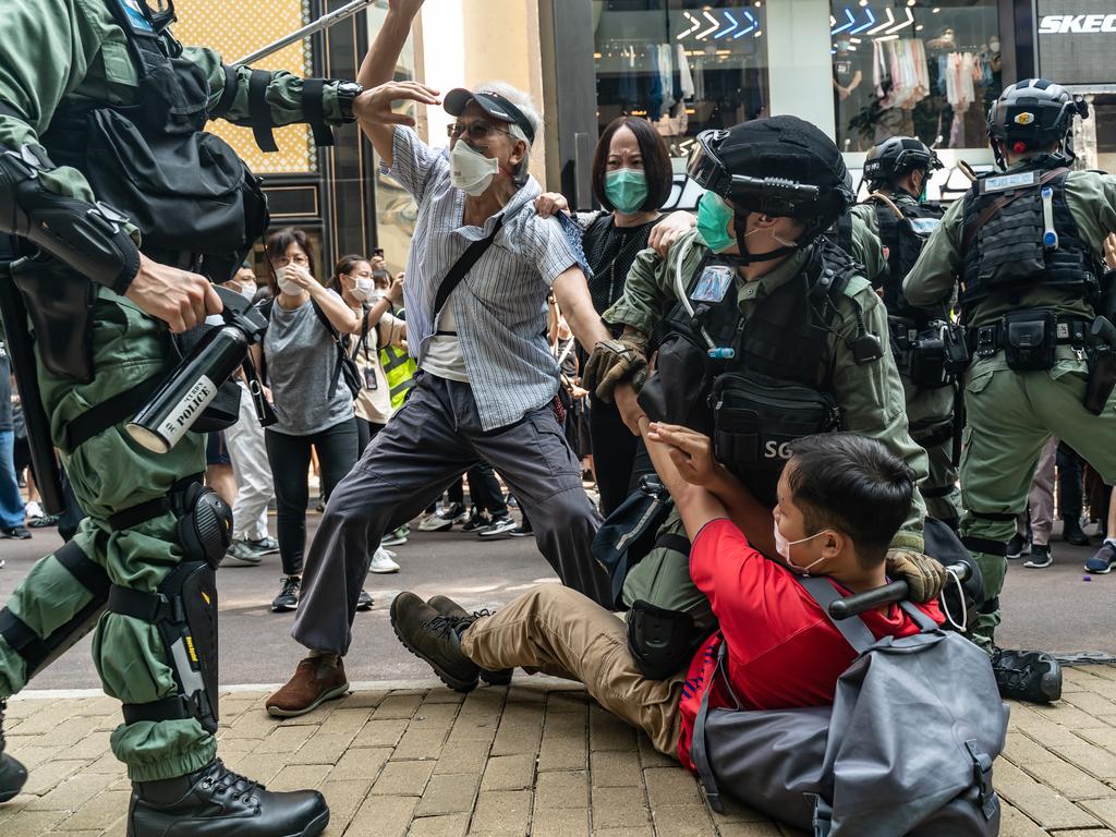 Pro-democracy supporters scuffle with riot police on May 27 in Hong Kong. Picture: Anthony Kwan/Getty Images