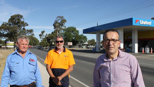 Local businessman and resident Neville Linke, Filmer Delivery owner Gary Curtis and local MP Tony Piccolo at the intersection.