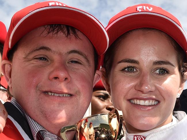 Steven (left) and Michelle Payne celebrate after Michelle rode Prince of Penzance to victory in the Melbourne Cup at Flemington Racecourse in Melbourne, Tuesday, Nov. 3, 2015. (AAP Image/Julian Smith) NO ARCHIVING, EDITORIAL USE ONLY