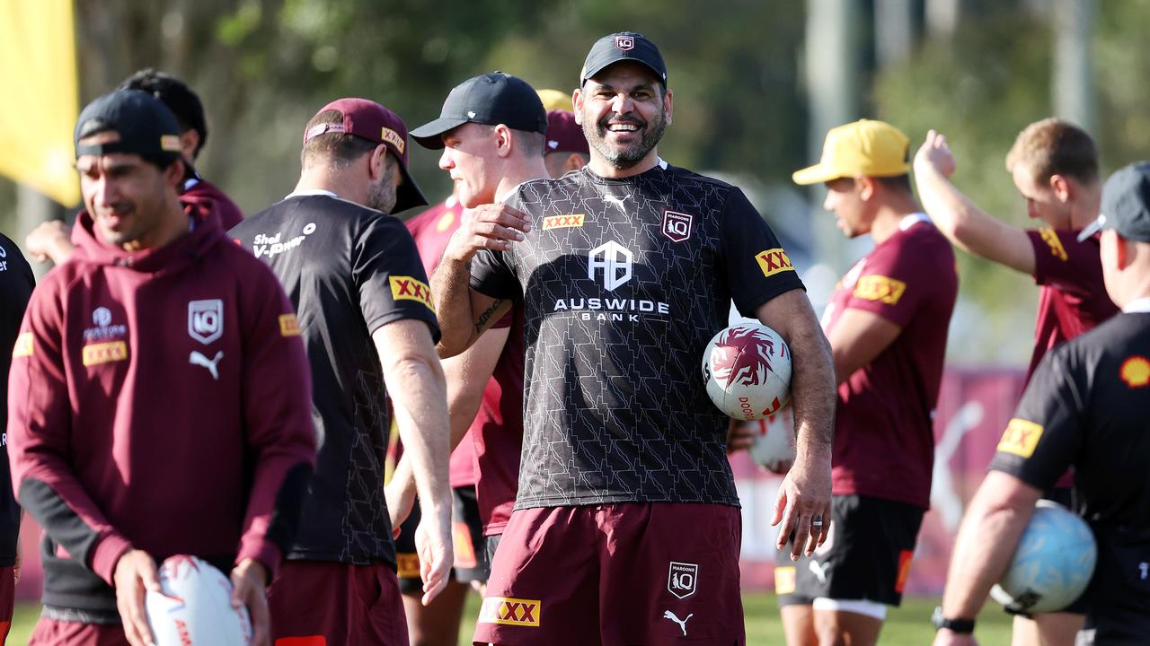Greg Inglis and the Maroons on the training track. Picture: Nigel Hallett