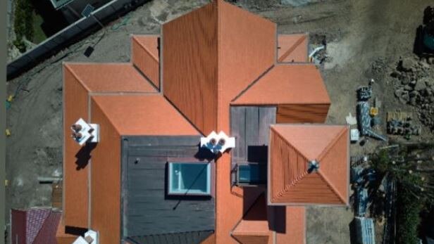 The finished roof with erracotta tiles in place, chimneys restored, operable hatch to tower, skylight above the new attic and copper roofing. @home_kangaroopoint @alex chomicz