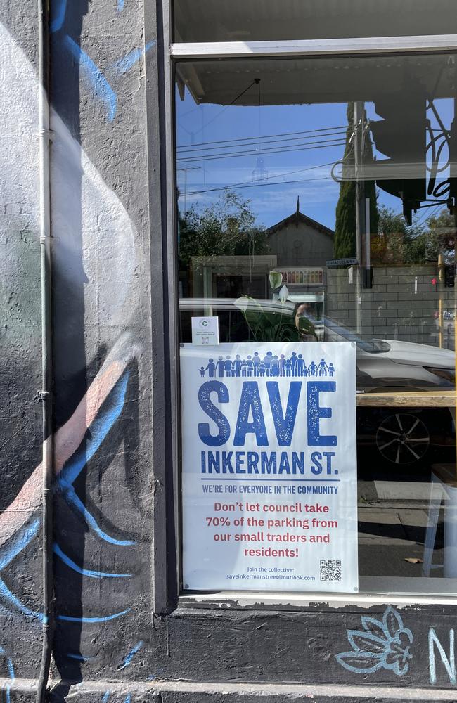 Businesses have been threatened with bad reviews by bike-advocates after displaying the Save Inkerman St posters.