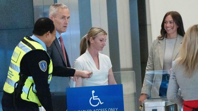 Jamie Kah leaves the hearing on Monday with Ruby McIntyre (right). Picture: Tony Gough