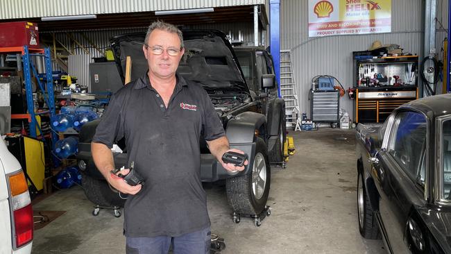 Cairns Auto Electrical Mechanical, Air and Audio managing director Brett O'Sughrue with some gadgets that can help avoid your car being stolen. Picture: Andreas Nicola