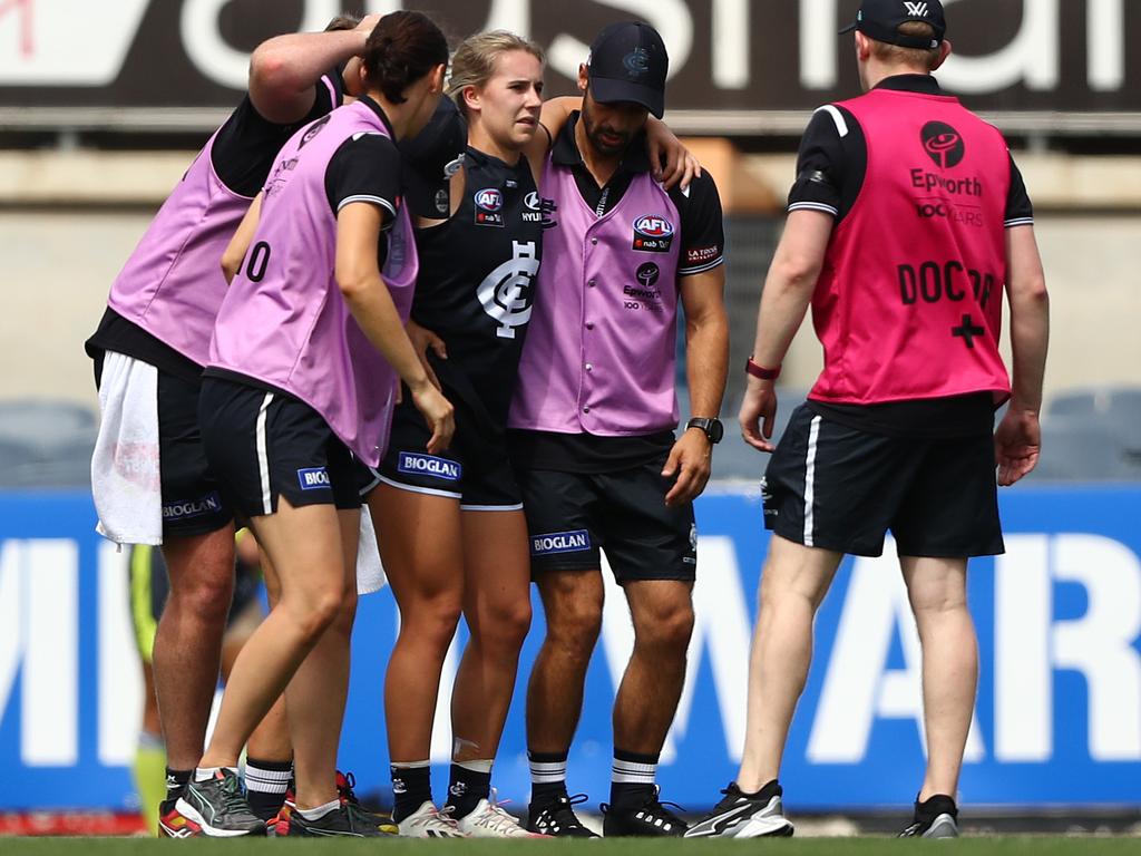 Hill is helped from the ground after injuring herself at Ikon Park.