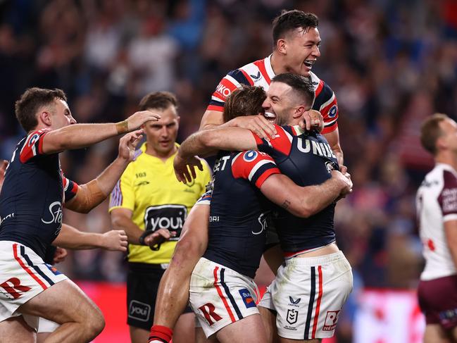 SYDNEY, AUSTRALIA - SEPTEMBER 21:  James Tedesco of the Roosters celebrates with team mates after scoring a try during the NRL Semi Final match between Sydney Roosters and Manly Sea Eagles at Allianz Stadium on September 21, 2024 in Sydney, Australia. (Photo by Jason McCawley/Getty Images)