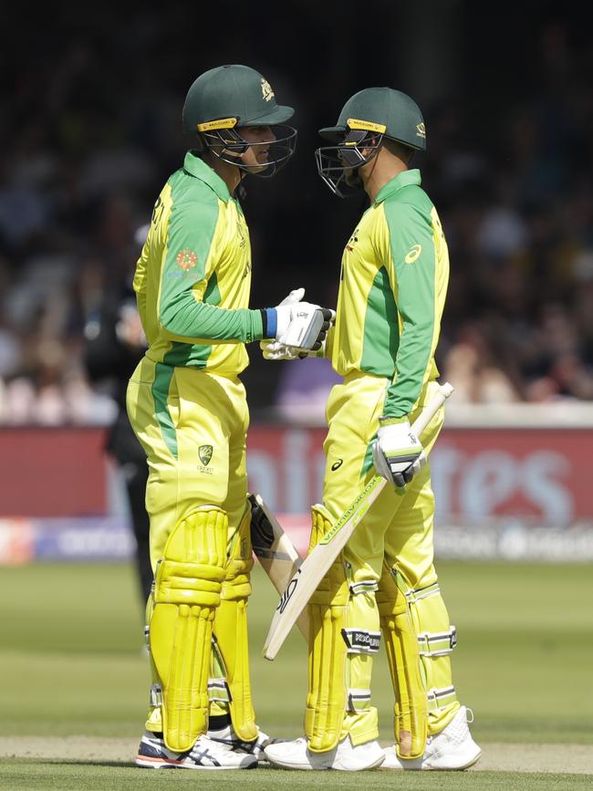 Usman Khawaja, right, celebrates with teammate Alex Carey after reaching 50 during the Cricket World Cup match between New Zealand and Australia at Lord's. Picture: AP Photo/Matt Dunham