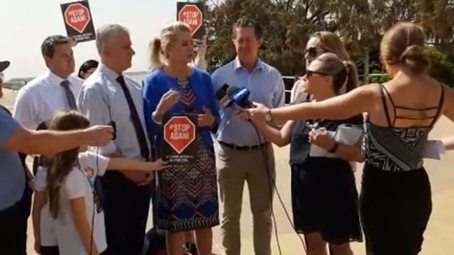 Mr McCormack asked a young girl to not hold an anti-Adani sign near Senator McKenzie’s face as she tried to continue with the press conference. Picture: Facebook/ABC Coffs Coast