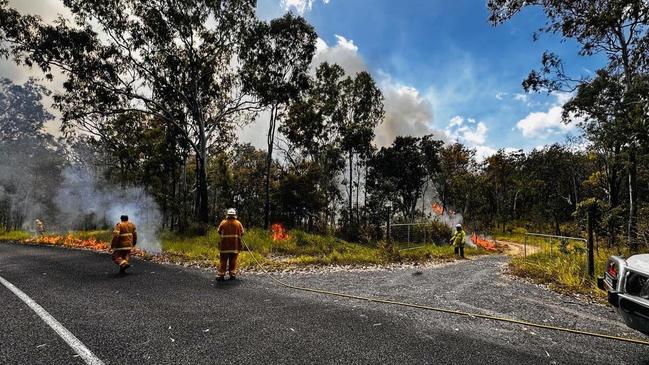 Firefighters undertake back burning activities on the Atherton Tablelands. Picture: Peta Davis-Staples