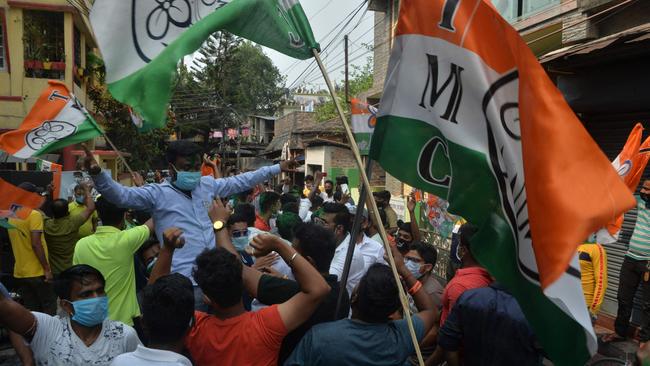 Indian supporters of the All India Trinamool Congress (AITC) celebrate the party's lead during the ongoing counting process of the West Bengal legislative assembly election. Picture: AFP