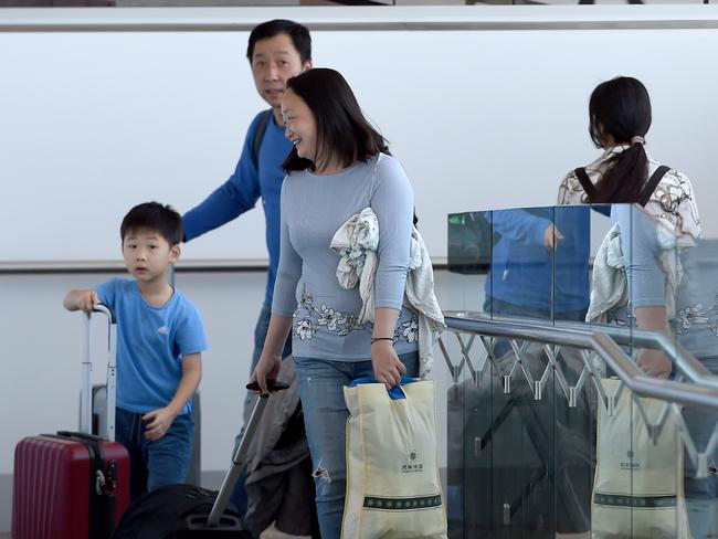 19.2.20 - Chartered flight from Christmas Island is expected to arrive in Adelaide at 4pm today - Jun Xu and Wei Sun with son Sim Xu, 6 from Adelaide (0403892480) arrived back to Adelaide on the flight. Photo Naomi Jellicoe